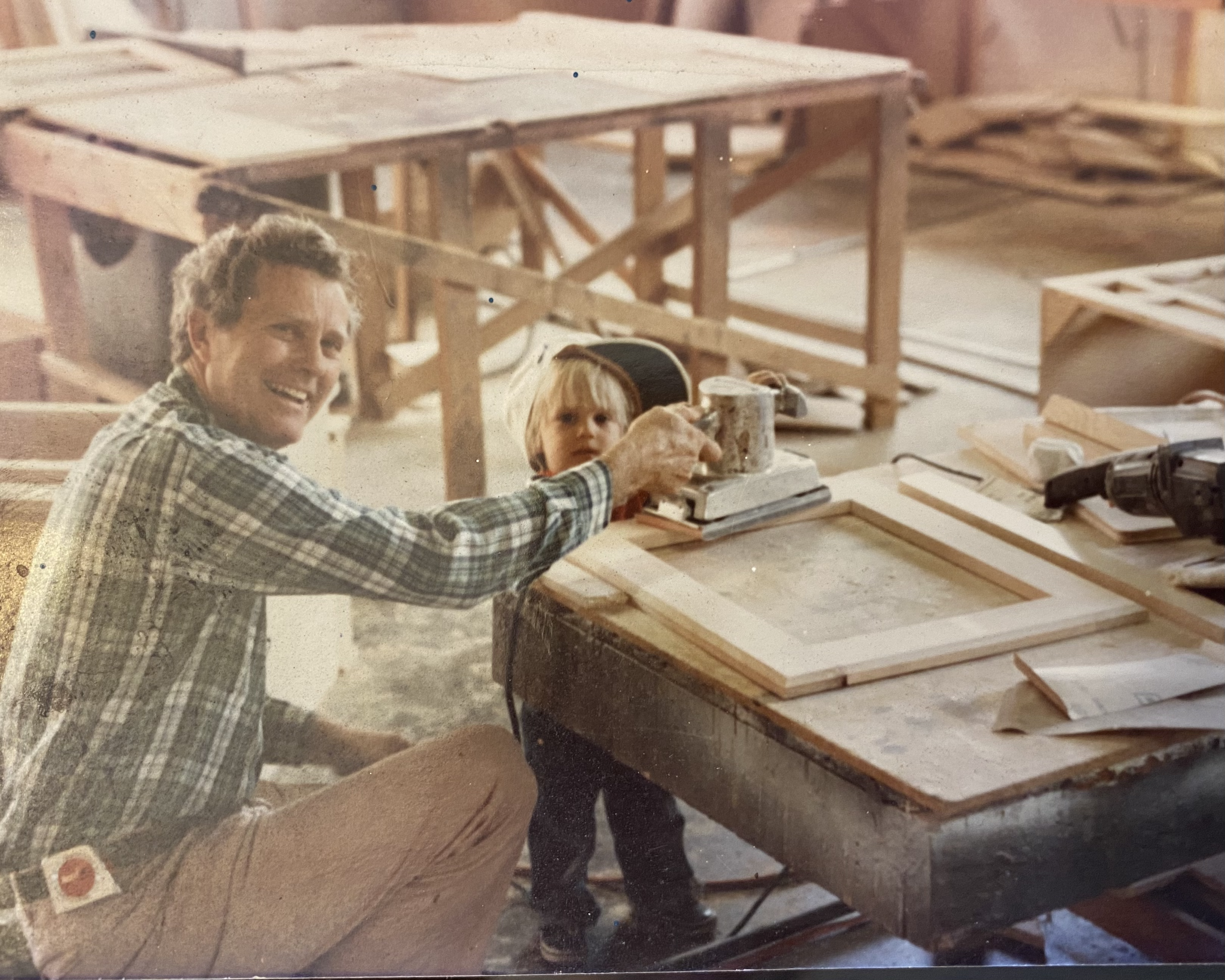 Bradley and his grandfather in the shop